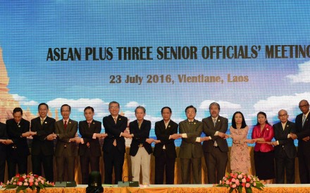 Officials from Asean and China, Japan and South Korea join hands at a meeting in Vientiane, Laos on Sunday. Photo: Xinhua Officials from Asean and China, Japan and South Korea join hands at a meeting in Vientiane, Laos on Sunday. Photo: Xinhua