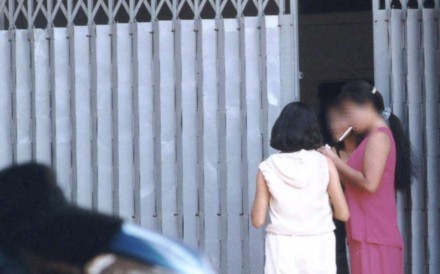 Sex workers on Svay Pak's main brothel strip. Mamasans there sell teenage girls’ viriginity to the highest bidder. Photo: James Thompson