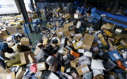 Employees work at a delivery service’s sorting centre ahead of the Singles’ Day online shopping festival in Beijing. Photo: Reuters