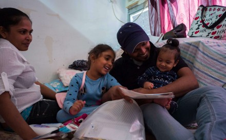 Nadeeka Dilrukshi Nonis (left) and partner Supun Thilina Kellapatha with their children. Photo: AFP
