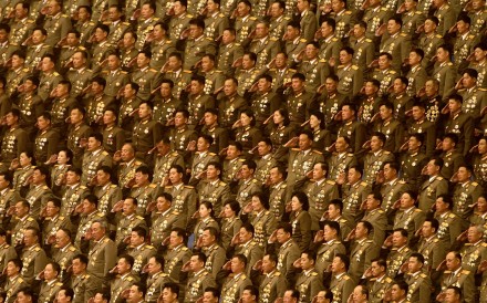 North Korean military officials salute during a patriotic concert in the Pyongyang Arena, in May last year. Photo: Washington Post North Korean military officials salute during a patriotic concert in the Pyongyang Arena, in May last year. Photo: Washington Post