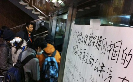 Chinese nationals wait to take buses provided by the Chinese embassy to be evacuated from the devastated city of Sendai, Miyagi prefecture after the 2011 earthquake and tsunami disasters. File photo: AFP