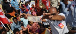 A member of the Communist Party of India displays a 1000 rupee note during a protest against Indian Prime Minister Narendra Modi and the withdrawal of the high-value banknotes from circulation. Photo: AFP/Arun Sankar A member of the Communist Party of India displays a 1000 rupee note during a protest against Indian Prime Minister Narendra Modi and the withdrawal of the high-value banknotes from circulation. Photo: AFP/Arun Sankar