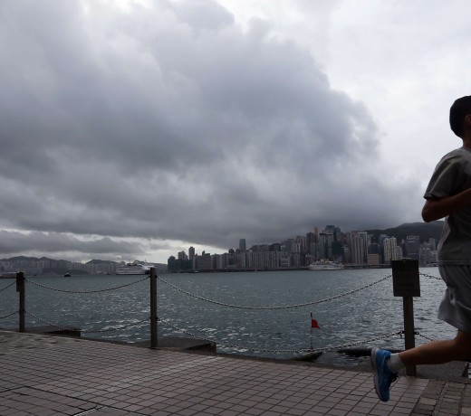 Stormy clouds greet a jogger on the Tsim Sha Tsui waterfront. Photo: Felix Wong