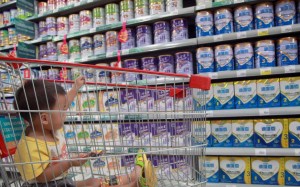 The suspects have been accused of buying cheap baby formula and adult milk powder and packaging it in fake tins of famous brands. Photo: AFP The suspects have been accused of buying cheap baby formula and adult milk powder and packaging it in fake tins of famous brands. Photo: AFP