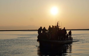 Migrants and refugees arrive aboard a Swedish Frontex patrol boat to the port of Mytilene on the Greek island of Lesbos. The EU-Turkey deal stipulates that those who reach the shores of Greece unlawfully will be returned to Turkey unless they qualify for asylum. The deal aims to break the lucrative smuggling operations now in Turkey. Photo: AFP