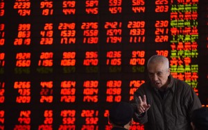 Investors monitoring share prices at a trading hall in Shenyang in northern China. Photo: Xinhua Investors monitoring share prices at a trading hall in Shenyang in northern China. Photo: Xinhua