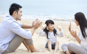 A young family enjoying a day at the beach in Hong Kong. Photo: Blue Jean Images/Corbis