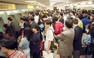 Hong Kong residents queue up in Immigration Tower, in Wan Chai, to apply for British passports before the handover. Pictures: SCMP Hong Kong residents queue up in Immigration Tower, in Wan Chai, to apply for British passports before the handover. Pictures: SCMP