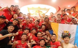Guangzhou Evergrande players pose for a photo in their dressing room after sealing a sixth league title. Photo: Weibo