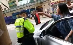 The woman is heard hurling abuse at the officer in the video. Photo: SCMP Pictures