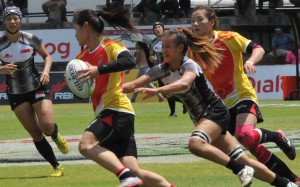 Members of China’s women's team compete against Singapore during the Asian Rugby Sevens Series Sri Lanka leg. Xinhua
