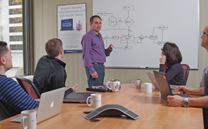 Workers at Absolute Software Corporation hold a meeting over a conference call with executives based in other cities in North America. CEO Geoff Haydon says 2015 was a “transformational” year for the company, as profits jumped more than 40%. Photo: Business in Vancouver Workers at Absolute Software Corporation hold a meeting over a conference call with executives based in other cities in North America. CEO Geoff Haydon says 2015 was a “transformational” year for the company, as profits jumped more than 40%. Photo: Business in Vancouver