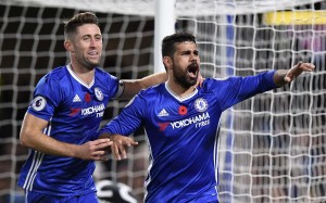 Chelsea's Diego Costa (R) is congratulated by teammate Gary Cahill after scoring against Everton EPA/WILL OLIVER