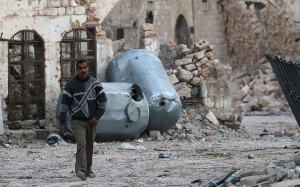 A man walks near rubble of damaged buildings, in the rebel-held besieged area of Aleppo. Photo: Reuters