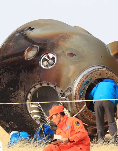Technicians examine the Shenzhou-11 re-entry capsule in Inner Mongolia on Friday. Photo: Xinhua Technicians examine the Shenzhou-11 re-entry capsule in Inner Mongolia on Friday. Photo: Xinhua