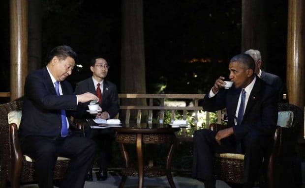 President Xi Jinping and US President Barack Obama hold talks over tea in a pavilion at the West Lake State Guest House in Hangzhou. Photo: AP President Xi Jinping and US President Barack Obama hold talks over tea in a pavilion at the West Lake State Guest House in Hangzhou. Photo: AP