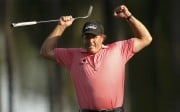 Phil Mickelson celebrates a long birdie putt on 16. Photo: Reuters
