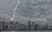 Thunder strikes a building in North Point. Photo: Felix Wong