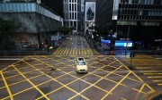 Empty streets in Central commercial area during morning peak hour in Hong Kong. Photo: David Wong