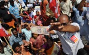 A member of the Communist Party of India displays a 1000 rupee note during a protest against Indian Prime Minister Narendra Modi and the withdrawal of the high-value banknotes from circulation. Photo: AFP/Arun Sankar A member of the Communist Party of India displays a 1000 rupee note during a protest against Indian Prime Minister Narendra Modi and the withdrawal of the high-value banknotes from circulation. Photo: AFP/Arun Sankar