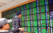 A monitor displaying prices at a stock exchange in Taipei, Taiwan. Henderson Global Investors is tipping Taiwanese equities to have a good 2017. Photo: EPA