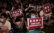 Supporters hold signs for Hong Kong independence during a rally in Tamar Park in 2016 . Photo: EPA