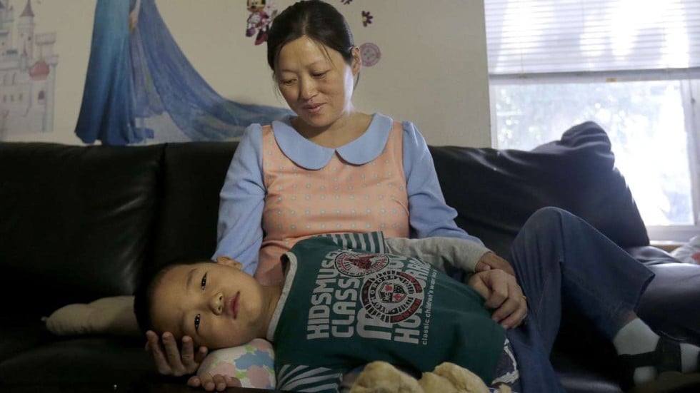 Pregnant wife and son of prominent Chinese dissident Zhao Changqing ... wife photo Pregnant wife and son of prominent Chinese dissident Zhao Changqing ... image