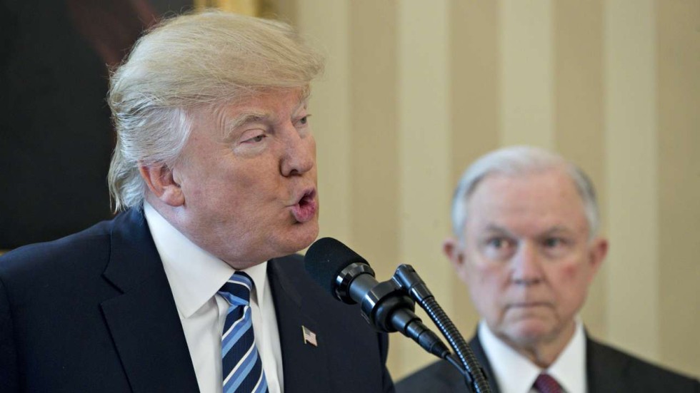 US President Donald Trump speaks at Jeff Sessions’ swearing in as US attorney general in the Oval Office of the White House on February 9. Photo: Bloomberg