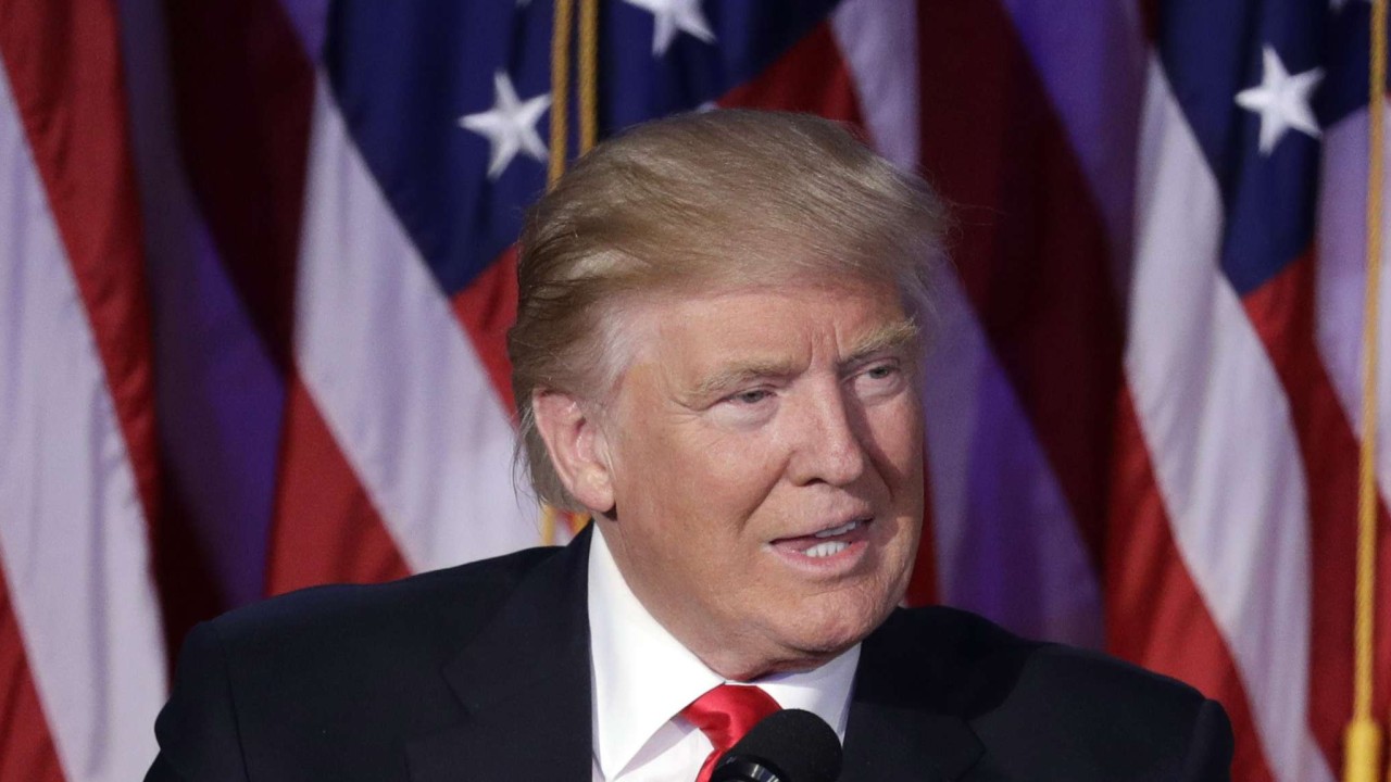 President-elect Donald Trump gives his acceptance speech during his election night rally on Wednesday, to applause from Vice-President-elect Mike Pence. Photo: AP