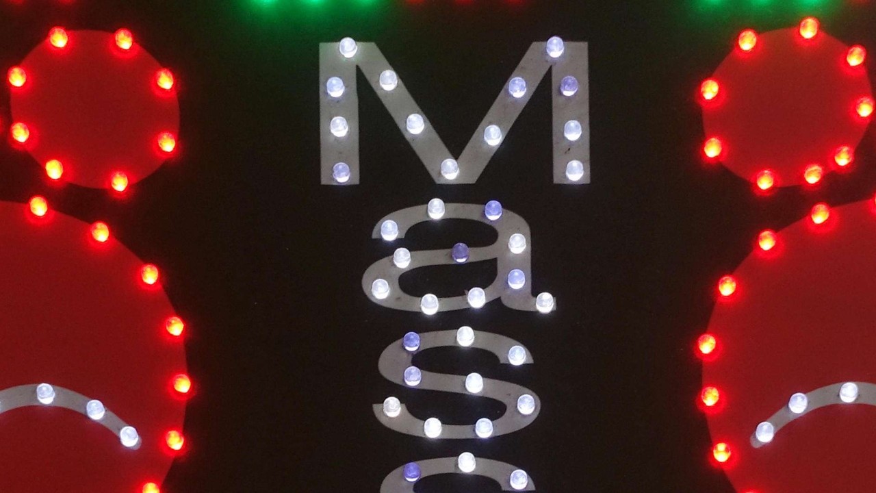 Cheap and cheerful seems to be the message this neon sign for foot massages in Hong Kong is conveying. Photo: Alamy