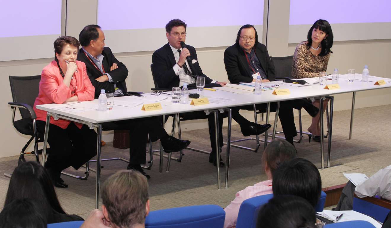 Su-Mei Thompson (right) moderates a forum, The Changing Role of Men, in 2012 with panellists (from left) Adrienne Burgess, CEO, The Fatherhood Institute of the UK; Paul Yip, professor of social work at the University of HOng Kong, Robin Egerton, chairperson of The Hong Kong Family Law Association; and Alex Lo, South China Morning Post columnist. Photo: Edward Wong