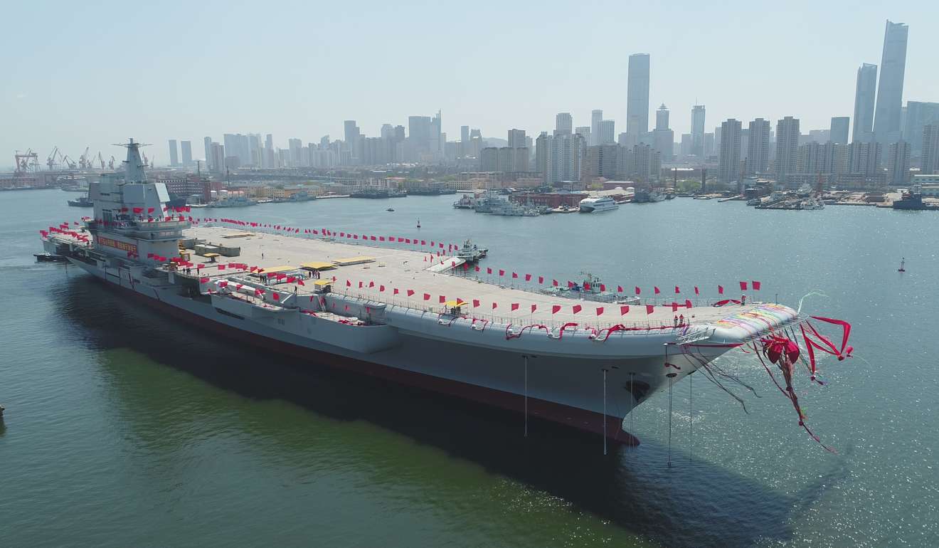 China's second aircraft carrier – and the first built domestically – is transferred last week from dry dock into the water at a launch ceremony in the Dalian shipyard of the China Shipbuilding Industry Corp in Dalian, Liaoning province. Photo: Xinhua