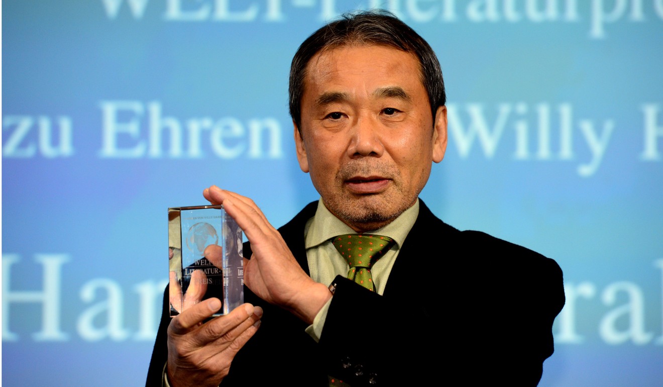 Japanese writer Haruki Murakami posing at an awards ceremony for Germany's Welt Literature Prize. Photo: AFP