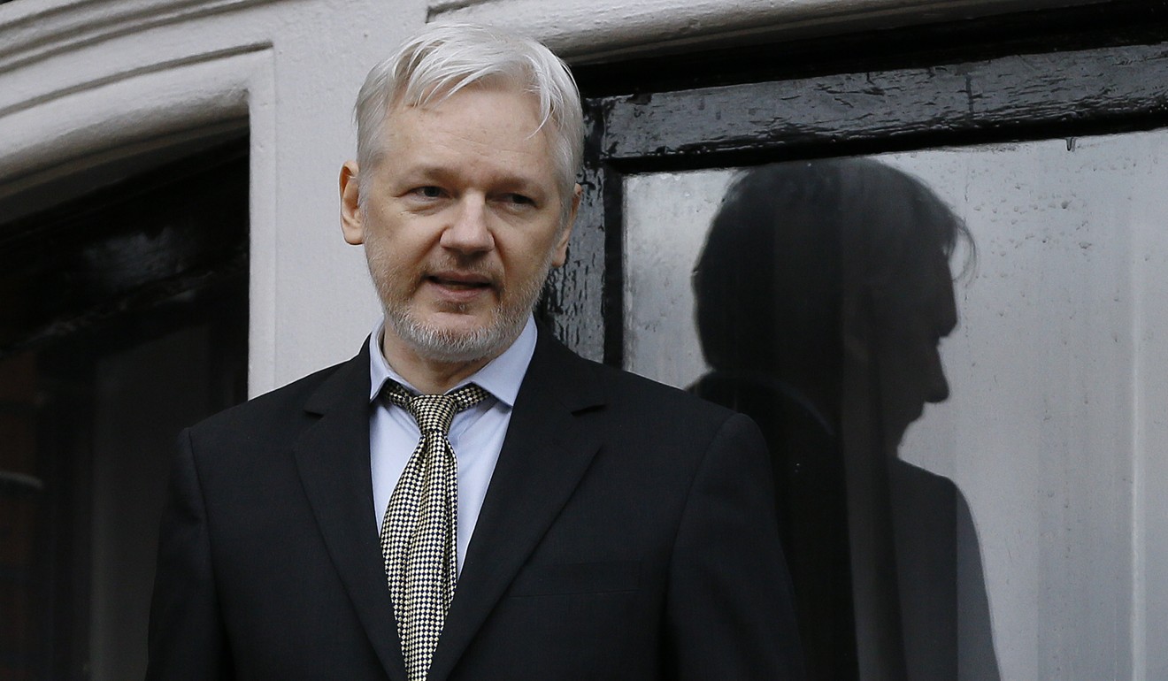 WikiLeaks founder Julian Assange speaks from the balcony of the Ecuadorean Embassy in London in February 2016. Photo: AP