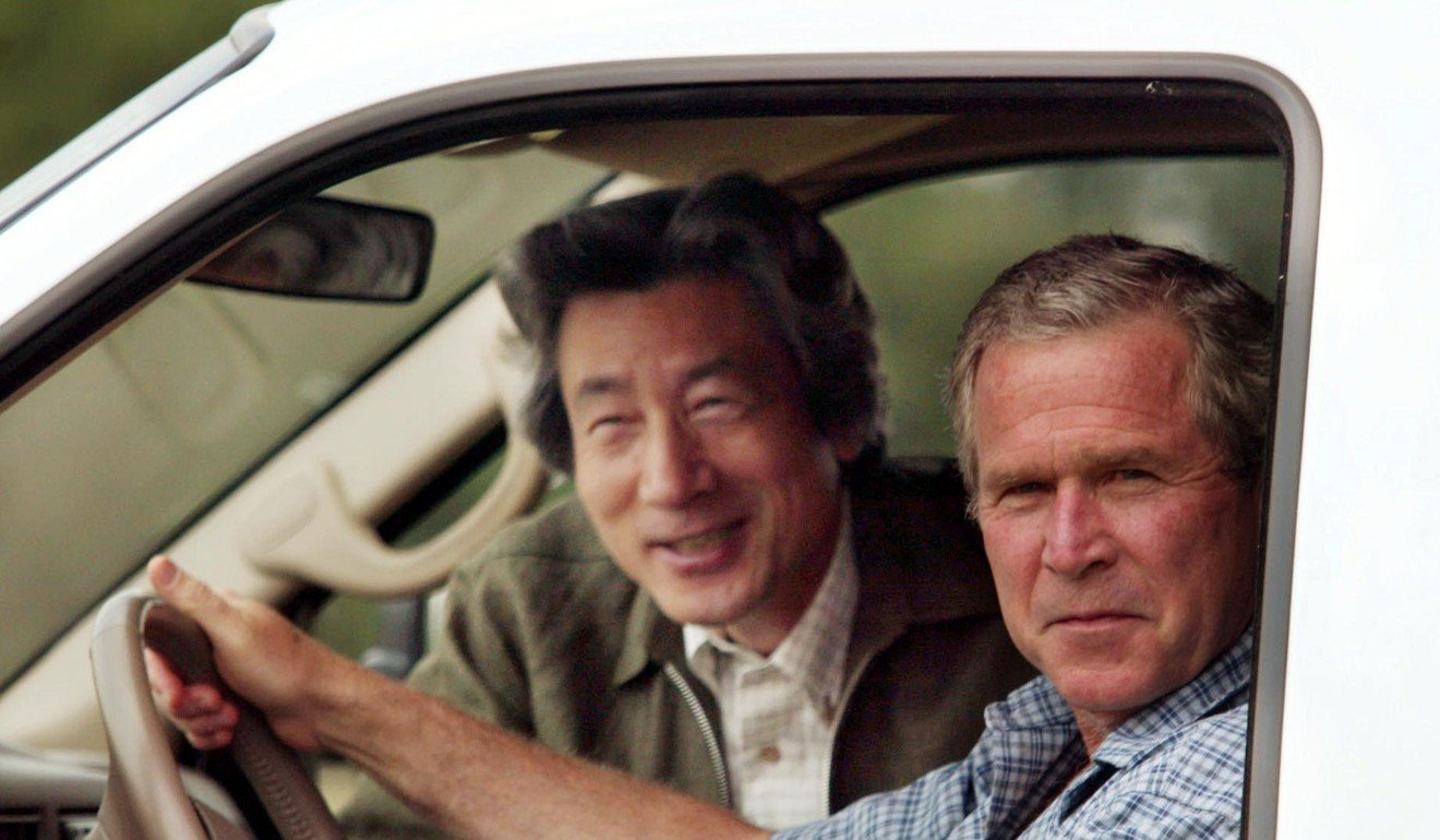 President George W. Bush drives Japan’s Prime Minister Junichiro Koizumi in his truck at his ranch in Crawford, Texas, in 2003. Photo: AP