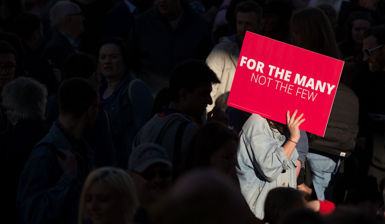 Supporters gather to listen to Britain's opposition Labour Party Leader Jeremy Corbyn addresses supporters in Manchester. Photo: AFP