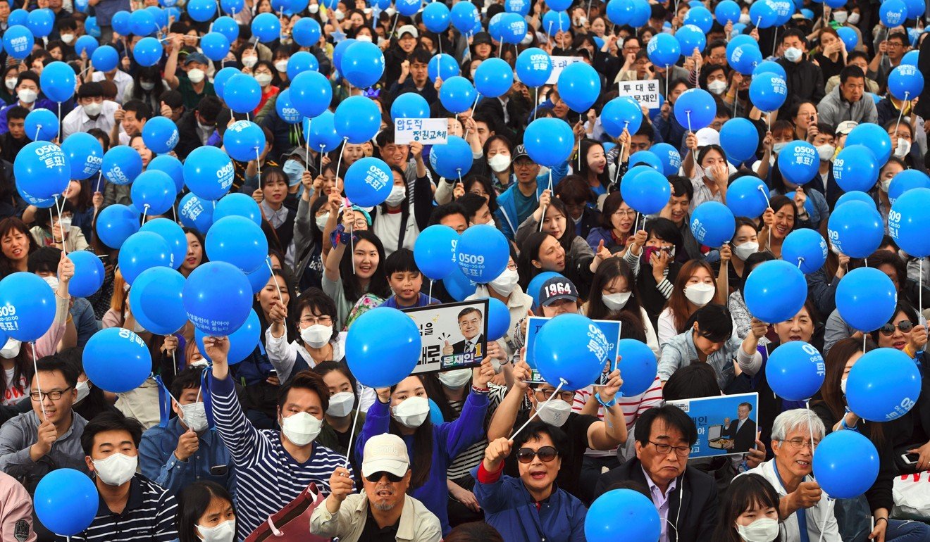 Supporters of South Korea’s Moon Jae-In of the Democratic Party wave blue balloons during an election campaign in Seoul. Photo: AFP