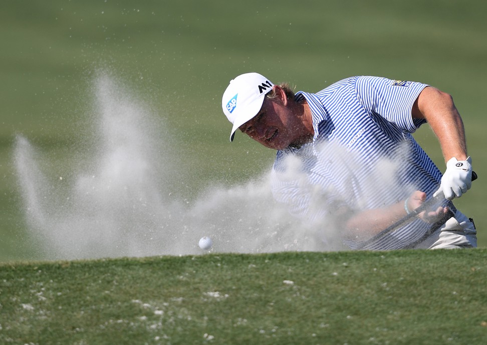 Ernie Els blasts out of the sand onto the 11th. Photo: USA Today