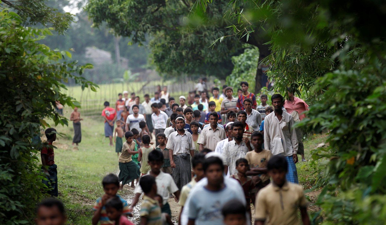Rohingya near a village outside Maugndaw in Rakhine state. Photo: Reuters