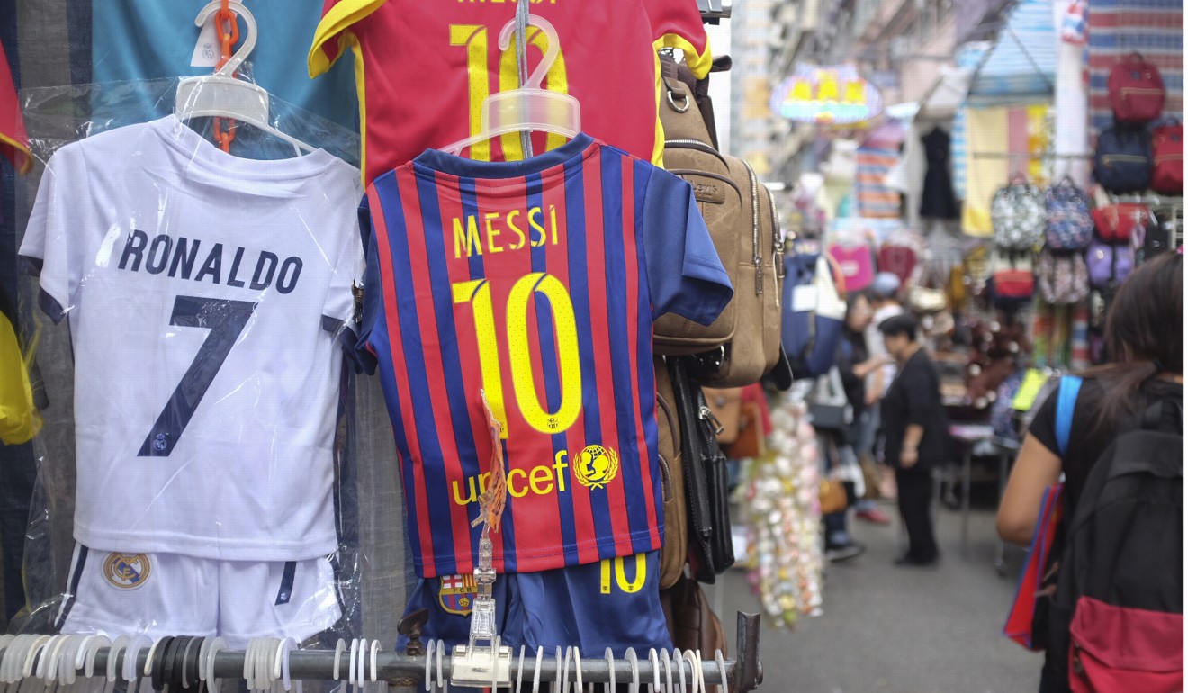 Cheap sports shirts are big business in Tung Choi Street. Photo: Alkira Reinfrank