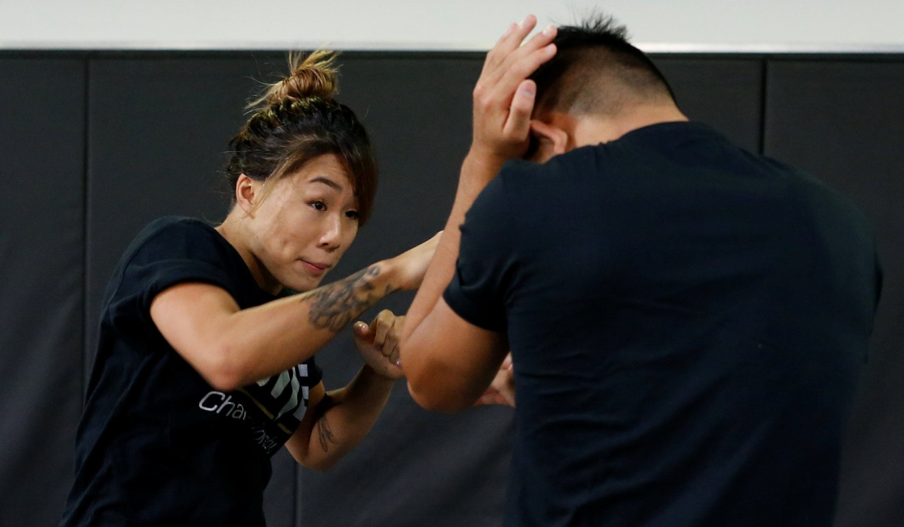 MMA fighter Angela Lee trains with her brother Christian Lee in Singapore. Photo: Reuters