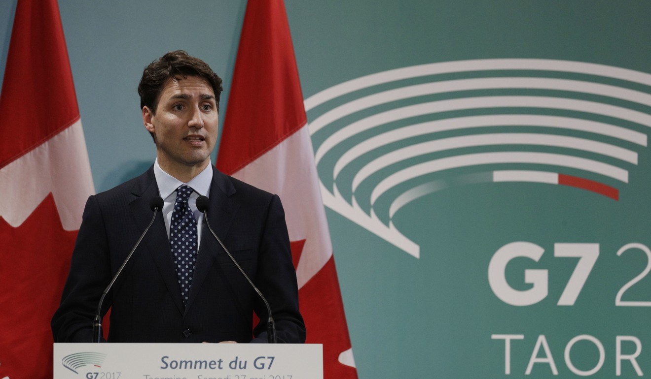 Canadian Prime Minister Justin Trudeau was more upbeat about Donald Trump’s outlook. Photo: AP
