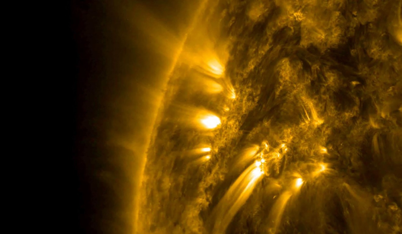 Several bright bands of plasma on the Sun connecting from one active region to another, even though they are tens of thousands of miles away from each other. Photo: AFP