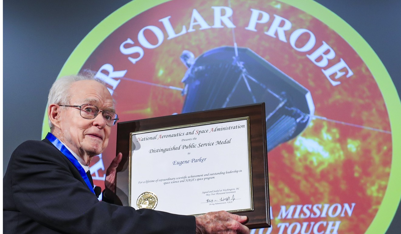 Dr Eugene Parker is presented the Nasa Distinguished Public Service Medial and Certificate at the introduction of the Parker Solar Probe, named in his honour, at the William Eckhardt Research Centre at the University of Chicago on Wednesday. Photo: EPA