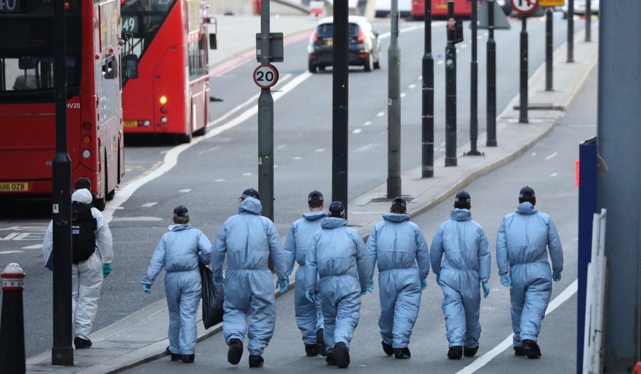 Crime scene investigators search for evidence on London Bridge on Sunday, the day after attacks on the bridge and nearby in London. Photo: EPA