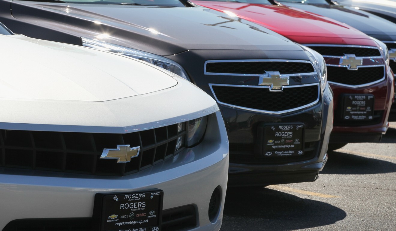 Chevrolet cars for sale at a dealership on in Chicago, Illinois. Car loan standards are being tightened as Americans deal with US$13 trillion in consumer debt. Photo: AFP
