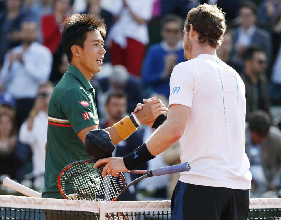 Nishikori and Murray shake hands after Murray’s victory. Photo: Kyodo