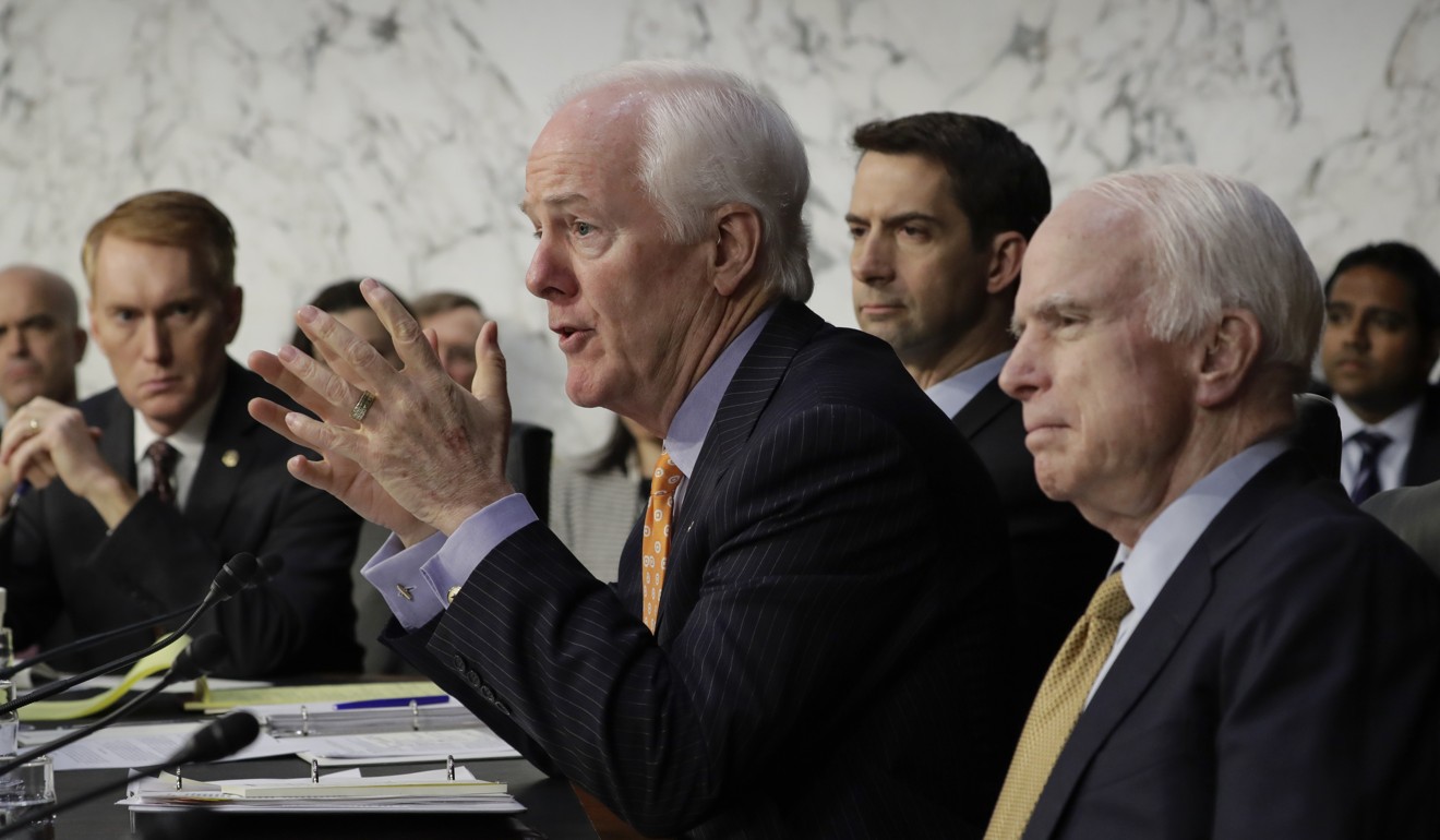 Republican members of the Senate Select Committee on Intelligence, from left, Sen. James Lankford, Sen. John Cornyn, Sen. Tom Cotton, and Sen. John McCain question former FBI director James Comey as he recounts a series of conversations with President Donald Trump. Photo: AP