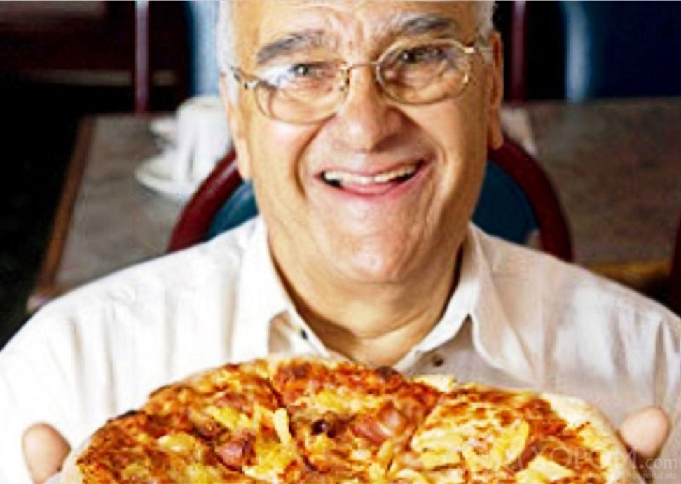 Sam Panopolous with his 1962 invention, the Hawaiian pizza. Photo: Handout